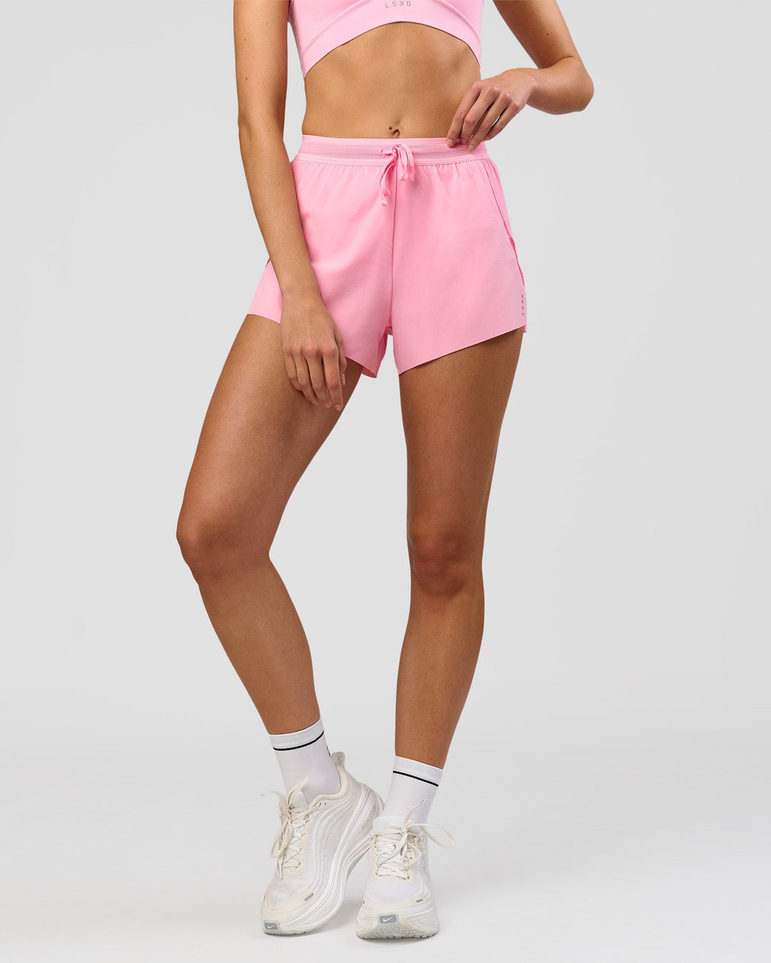 Woman wearing Accelerate 3" High-Rise Running Short - Pink Rose | Model:Taneisha | Size:XS - view 10