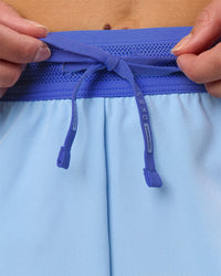 Woman wearing Accelerate 3" High-Rise Running Short - Power Cobalt-Open Air | Model:Taneisha | Size:XS | Thumbnail Index: 1
