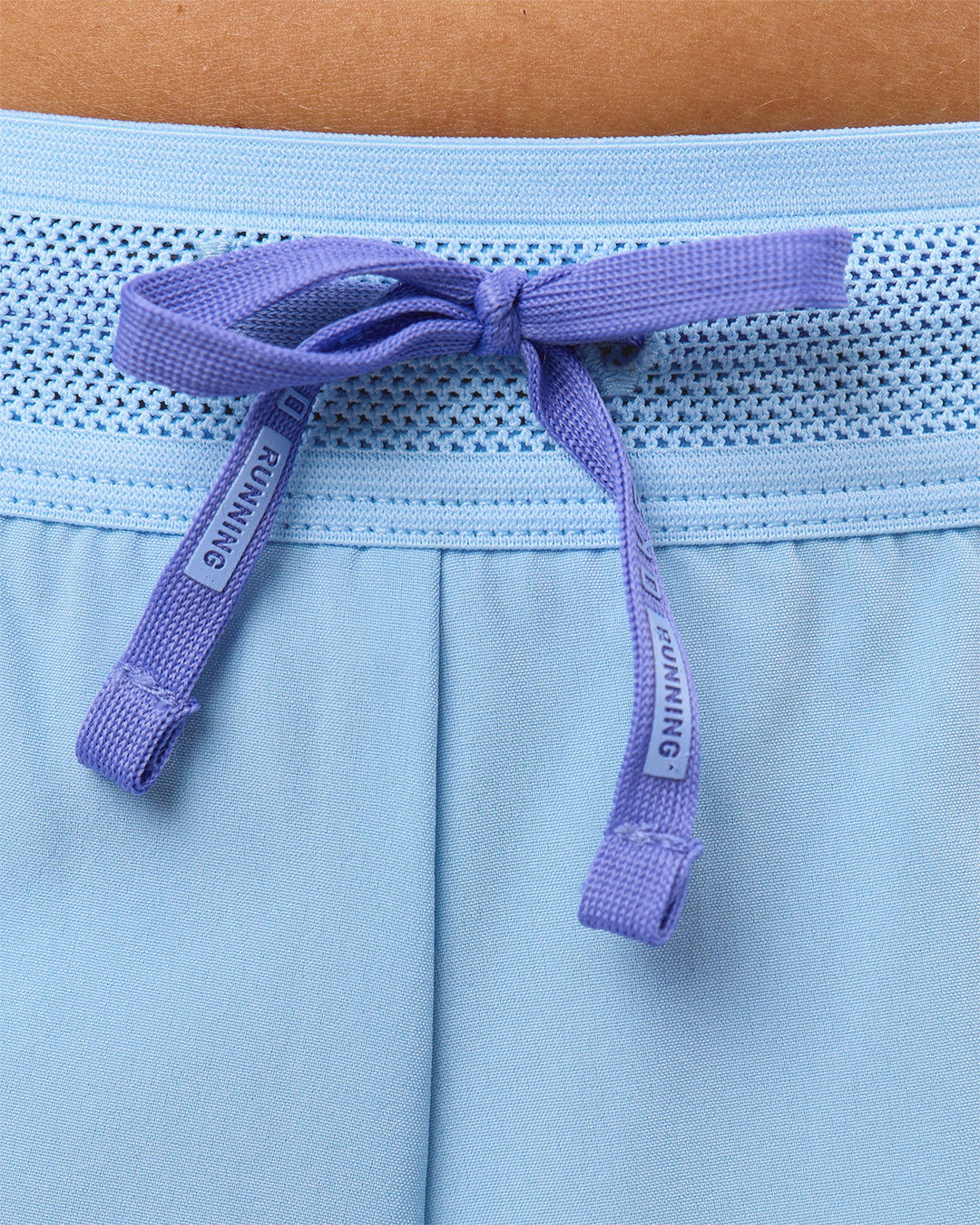 Woman wearing Accelerate 3" Mid-Rise Running Short - Bluebell-Open Air | Model:Taneisha | Size:XS - view 12