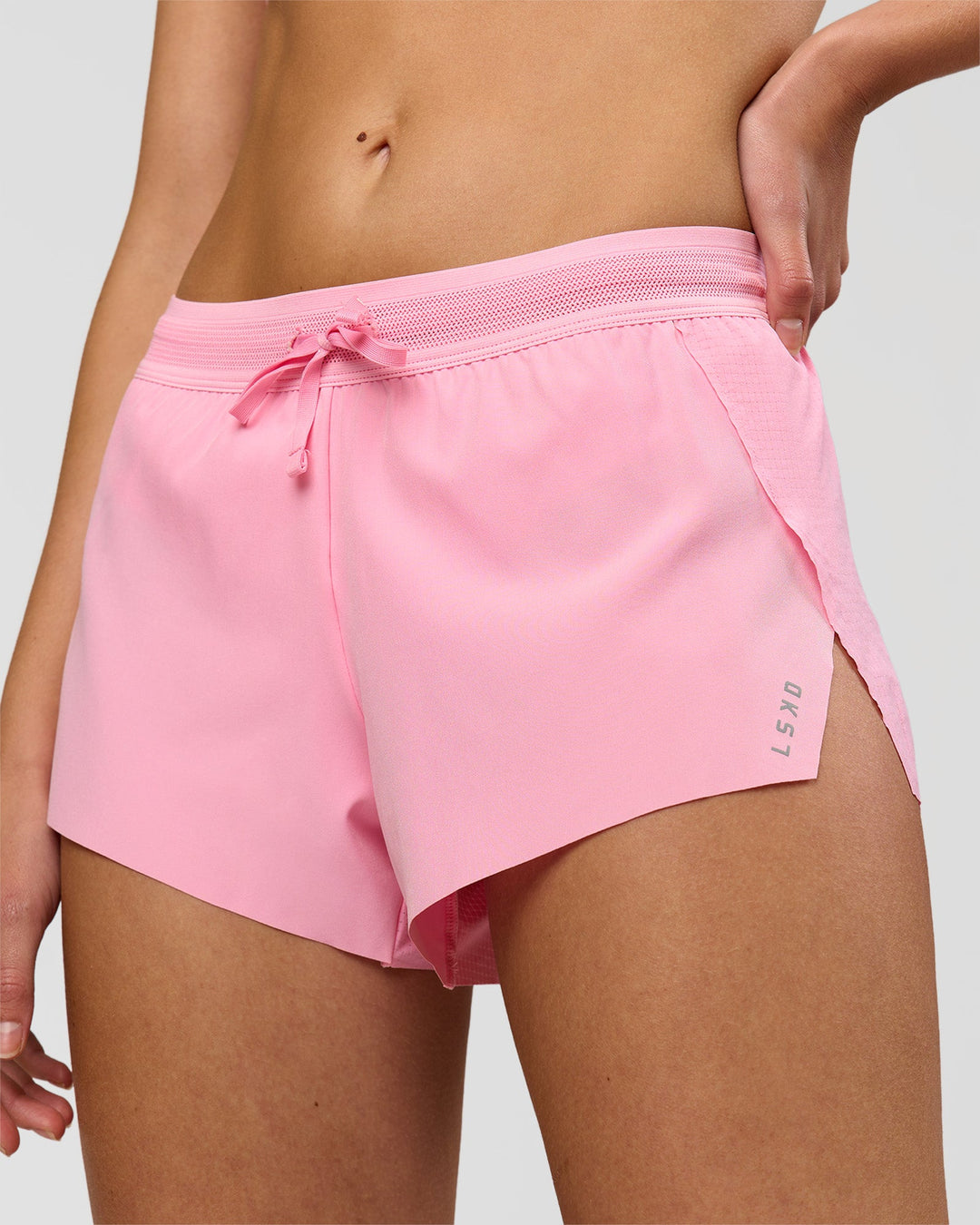 Woman wearing Accelerate 3" Mid-Rise Running Short - Pink Rose | Model:Taneisha | Size:XS