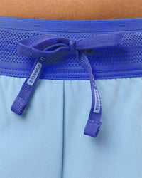 Woman wearing Accelerate 3" Mid-Rise Running Short - Power Cobalt-Open Air | Model:Taneisha | Size:XS | Thumbnail Index: 2
