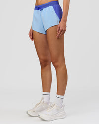 Woman wearing Accelerate 3" Mid-Rise Running Short - Power Cobalt-Open Air | Model:Taneisha | Size:XS | Thumbnail Index: 4