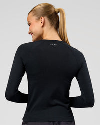Woman wearing AeroFLX+ Seamless Long Sleeve Tee - Black Marl | Model:Taneisha | Size:XS | Thumbnail Index: 3