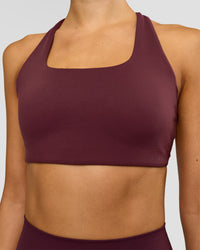 Woman wearing Aspire Sports Bra - Cherry Lacquer | Model:Taneisha | Size:XS | Thumbnail Index: 2