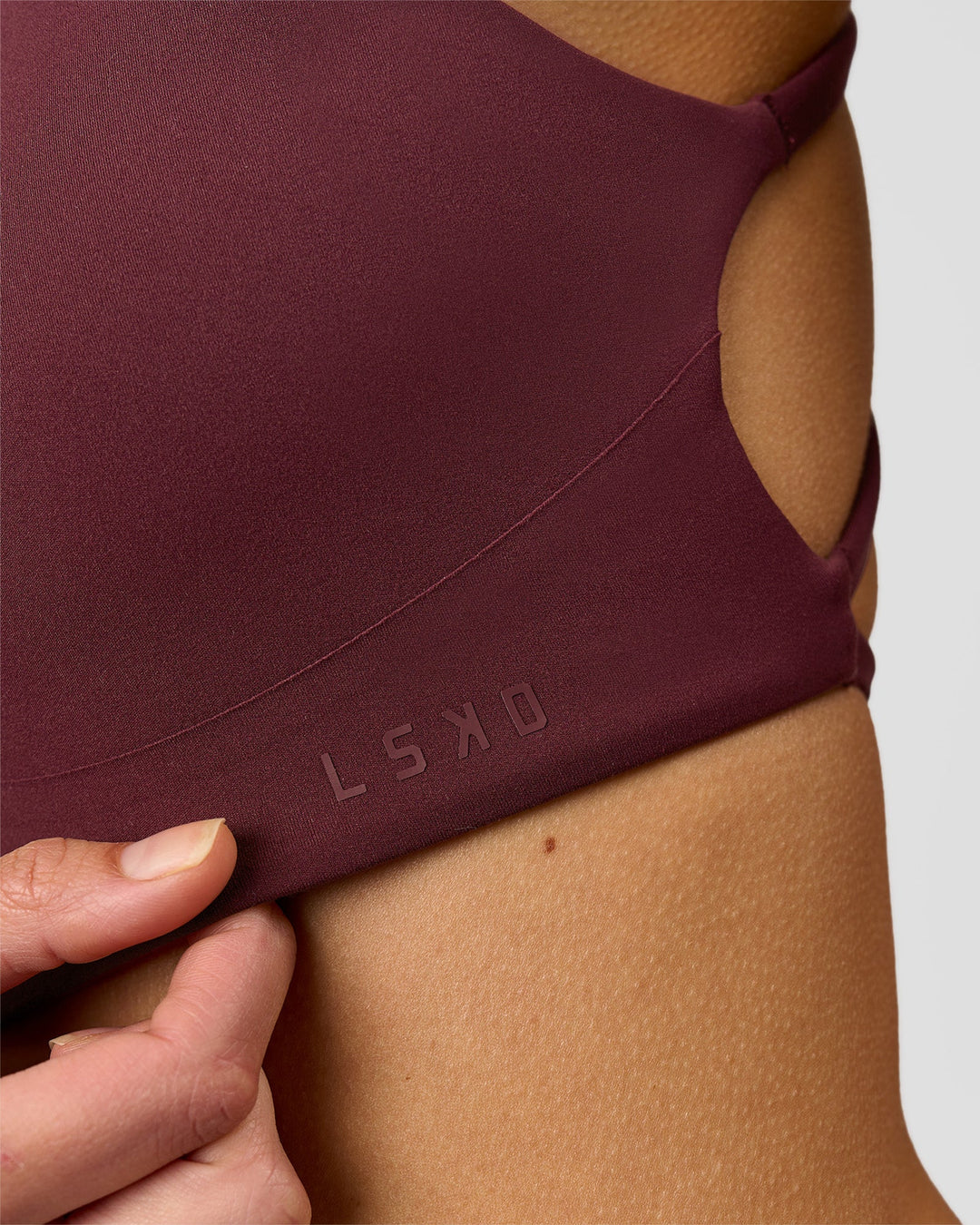 Woman wearing Aspire Sports Bra - Cherry Lacquer | Model:Taneisha | Size:XS - view 5