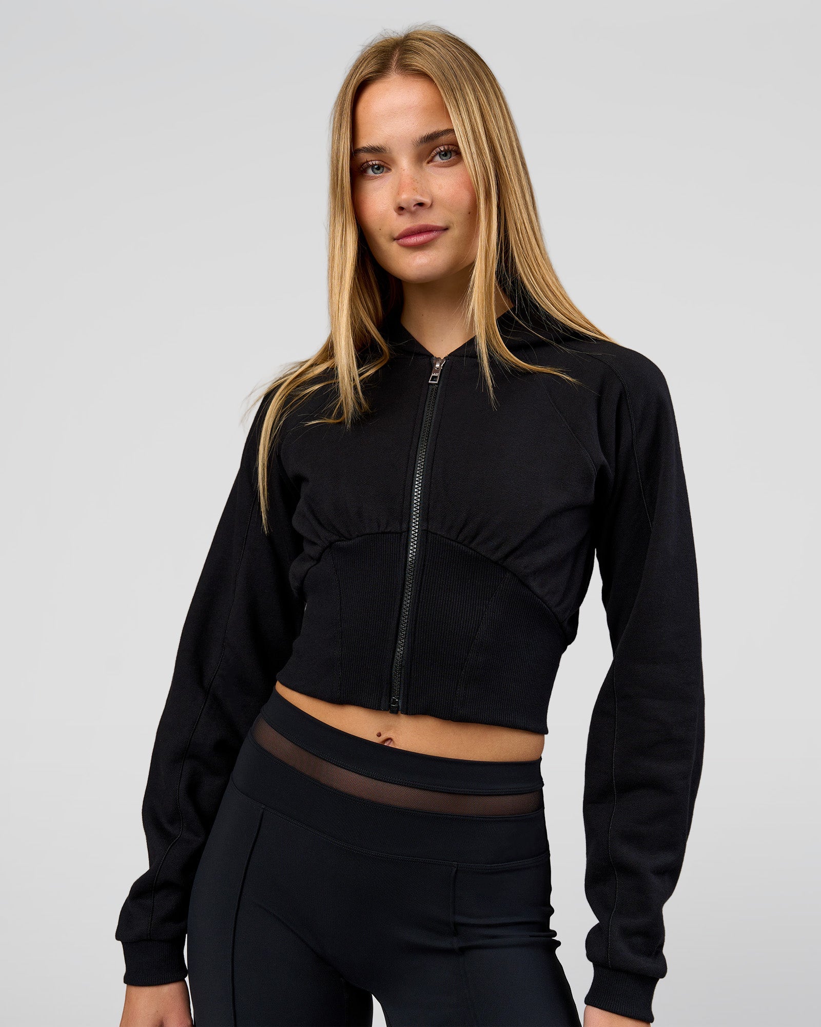 Woman wearing Bend Contour Silhouette Zip Through Hoodie - Black | Model:Taneisha | Size:XS