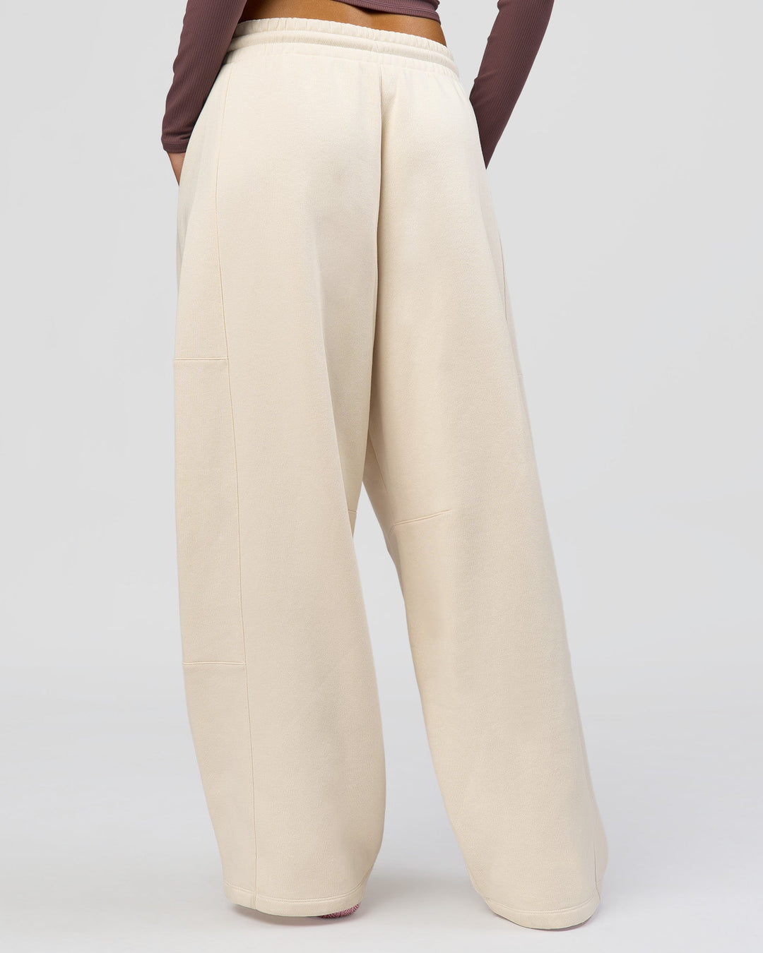 Woman wearing Bree Barrel Fleece Track Pant - Vanilla Bean | Model:Taneisha | Size:XS - view 9