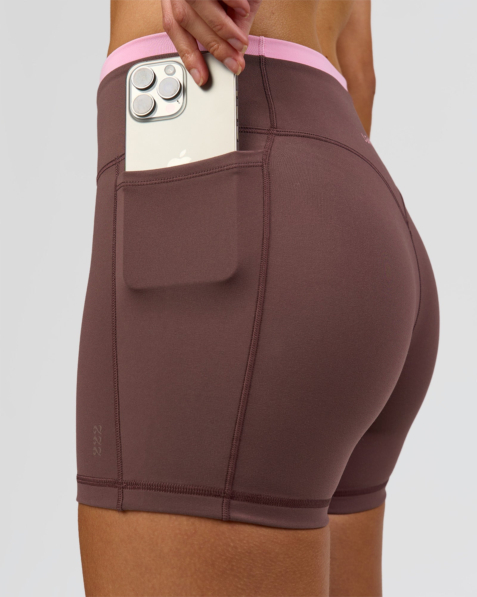 Woman wearing Bree Fusion High-Rise 4" Short Pockets - Cocoa Powder-Pink Rose | Model:Taneisha | Size:XS