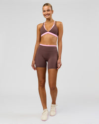 Woman wearing Bree Fusion High-Rise 6" Short Pockets - Cocoa Powder-Pink Rose | Model:Taneisha | Size:XS | Thumbnail Index: 1
