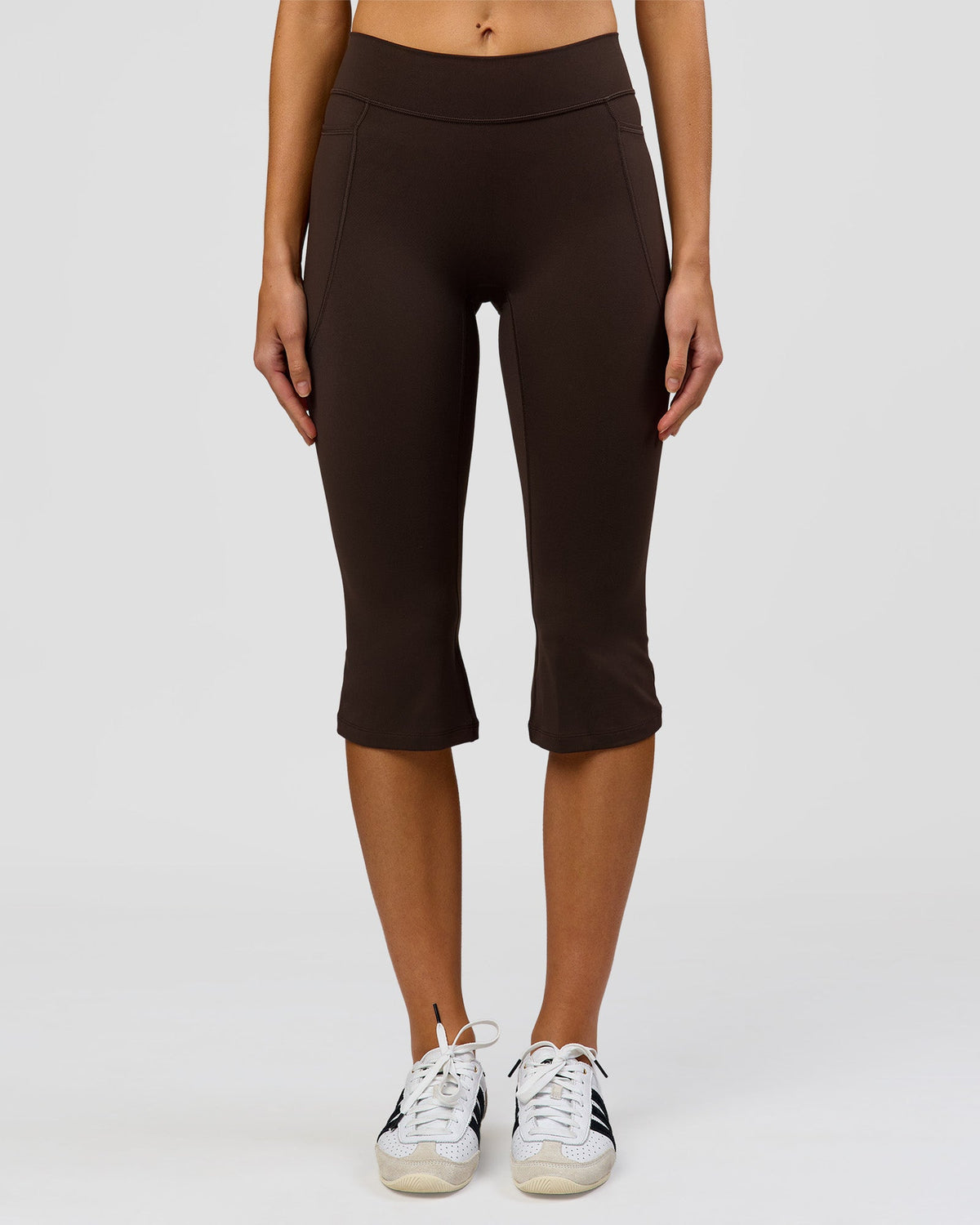 Woman wearing Deep V-Contour High-Rise Flared Capri - Ground Coffee | Model:Taneisha | Size:XS