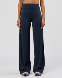 Woman wearing Elixir High-Rise Tall Pant - Midnight Navy | Model:Taneisha | Size:XS | Thumbnail Index: 7