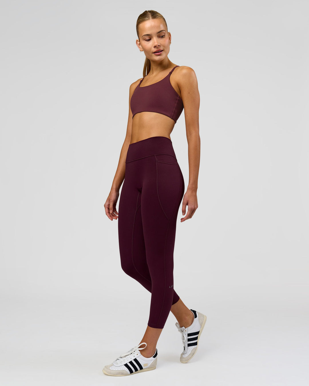 Woman wearing Fusion High-Rise 7/8 Legging Pockets - Cherry Lacquer | Model:Taneisha | Size:XS - view 2