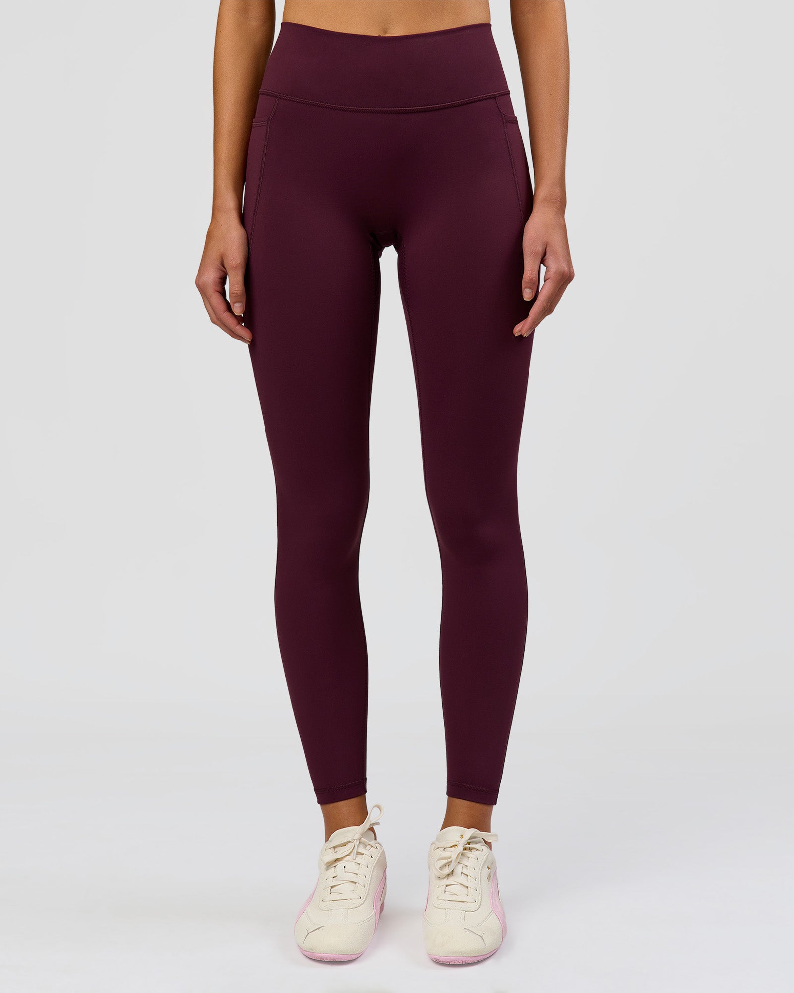 Woman wearing Fusion High-Rise Full Length Legging Pockets - Cherry Lacquer | Model:Taneisha | Size:XS