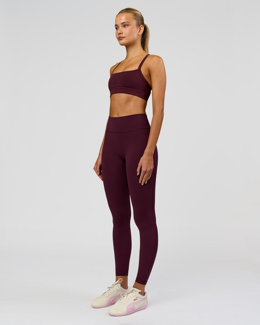 Woman wearing Fusion High-Rise Full Length Legging Pockets - Cherry Lacquer | Model:Taneisha | Size:XS - view 3