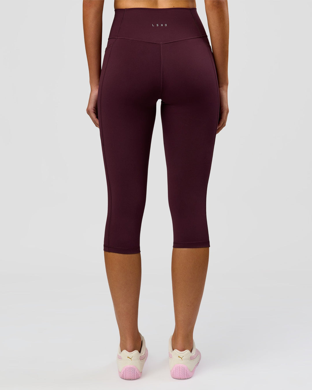 Woman wearing Fusion Ultra High-Rise 3/4 Legging Pockets - Cherry Lacquer | Model:Taneisha | Size:XS - view 6