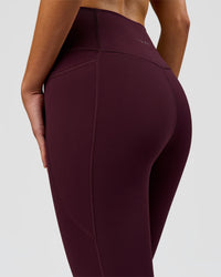 Woman wearing Fusion Ultra High-Rise 3/4 Legging Pockets - Cherry Lacquer | Model:Taneisha | Size:XS | Thumbnail Index: 7
