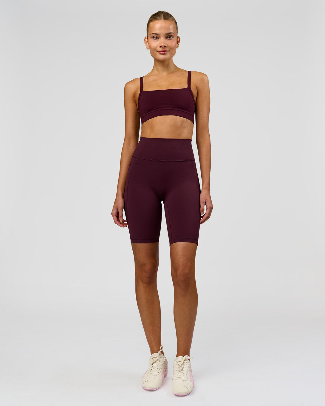 Woman wearing Fusion Ultra High-Rise 9" Short Pockets - Cherry Lacquer | Model:Taneisha | Size:XS - view 3