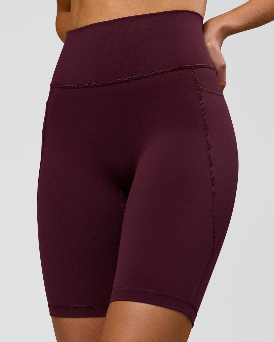Woman wearing Fusion Ultra High-Rise 9" Short Pockets - Cherry Lacquer | Model:Taneisha | Size:XS - view 1