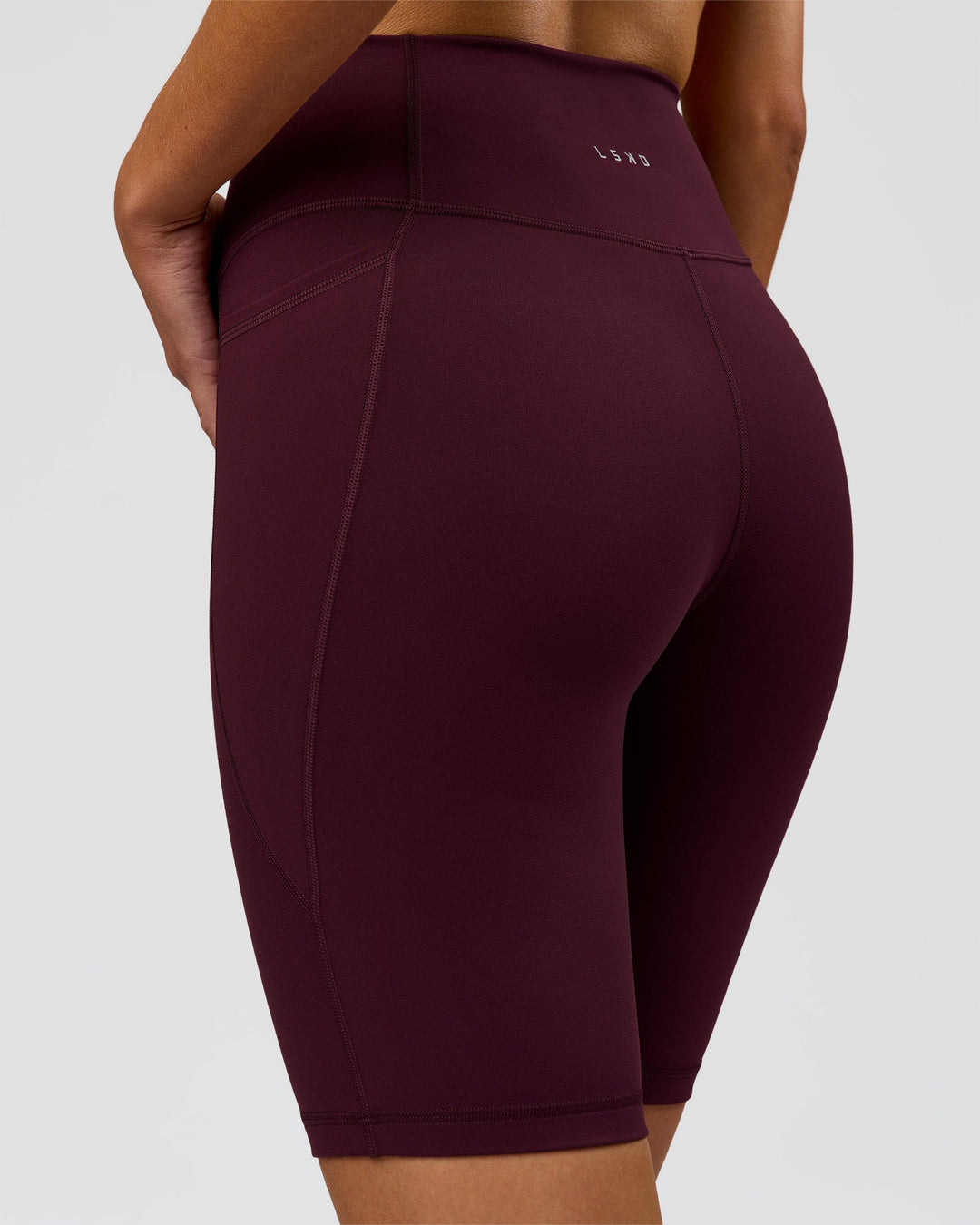 Woman wearing Fusion Ultra High-Rise 9" Short Pockets - Cherry Lacquer | Model:Taneisha | Size:XS - view 4