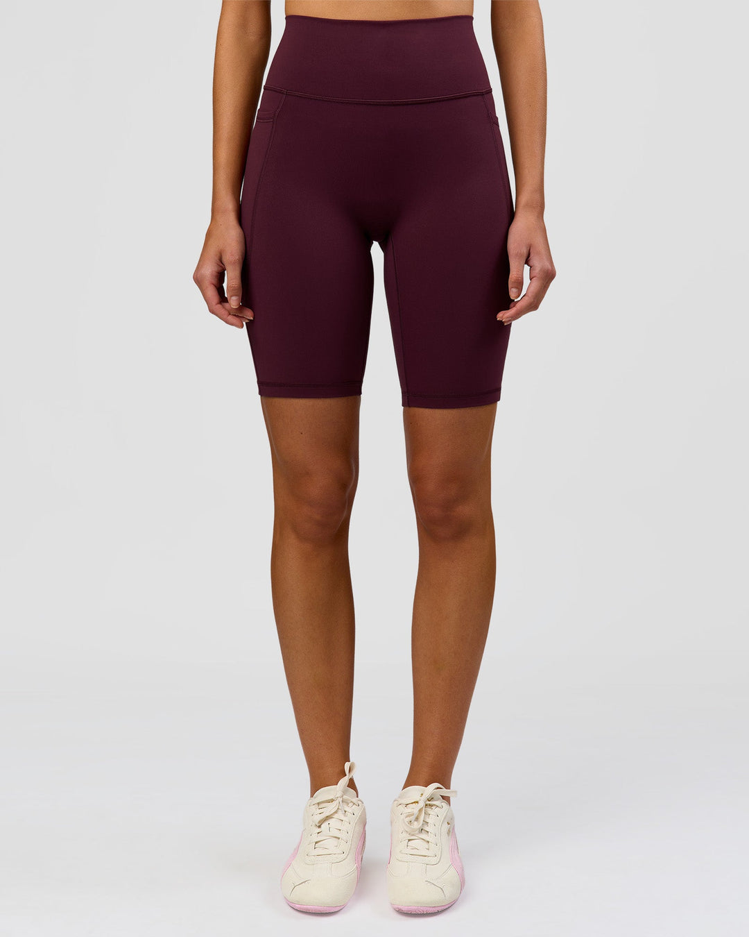 Woman wearing Fusion Ultra High-Rise 9" Short Pockets - Cherry Lacquer | Model:Taneisha | Size:XS - view 2