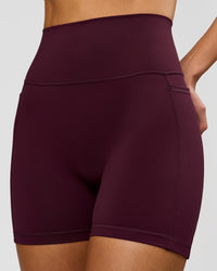 Woman wearing Fusion V-Contour Ultra High-Rise 4" Short Pockets - Cherry Lacquer | Model:Taneisha | Size:XS | Thumbnail Index: 1