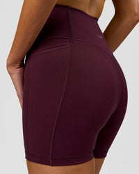Woman wearing Fusion V-Contour Ultra High-Rise 4" Short Pockets - Cherry Lacquer | Model:Taneisha | Size:XS | Thumbnail Index: 9