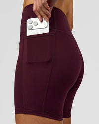Woman wearing Fusion V-Contour Ultra High-Rise 6" Short Pockets - Cherry Lacquer | Model:Taneisha | Size:XS | Thumbnail Index: 3