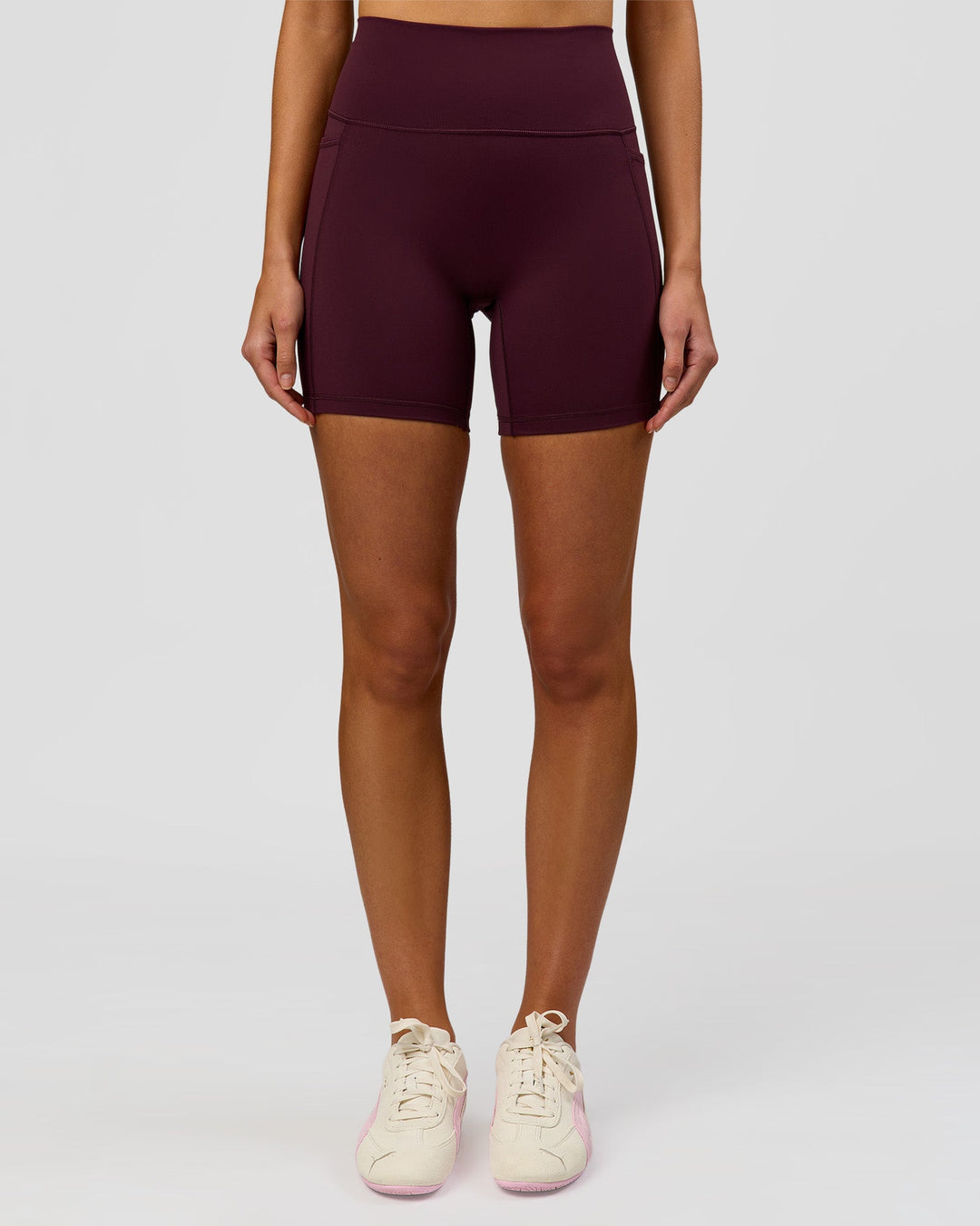 Woman wearing Fusion V-Contour Ultra High-Rise 6" Short Pockets - Cherry Lacquer | Model:Taneisha | Size:XS - view 5
