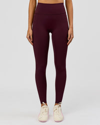 Woman wearing Fusion V-Contour Ultra High-Rise Full Length Legging Pockets - Cherry Lacquer | Model:Taneisha | Size:XS | Thumbnail Index: 4