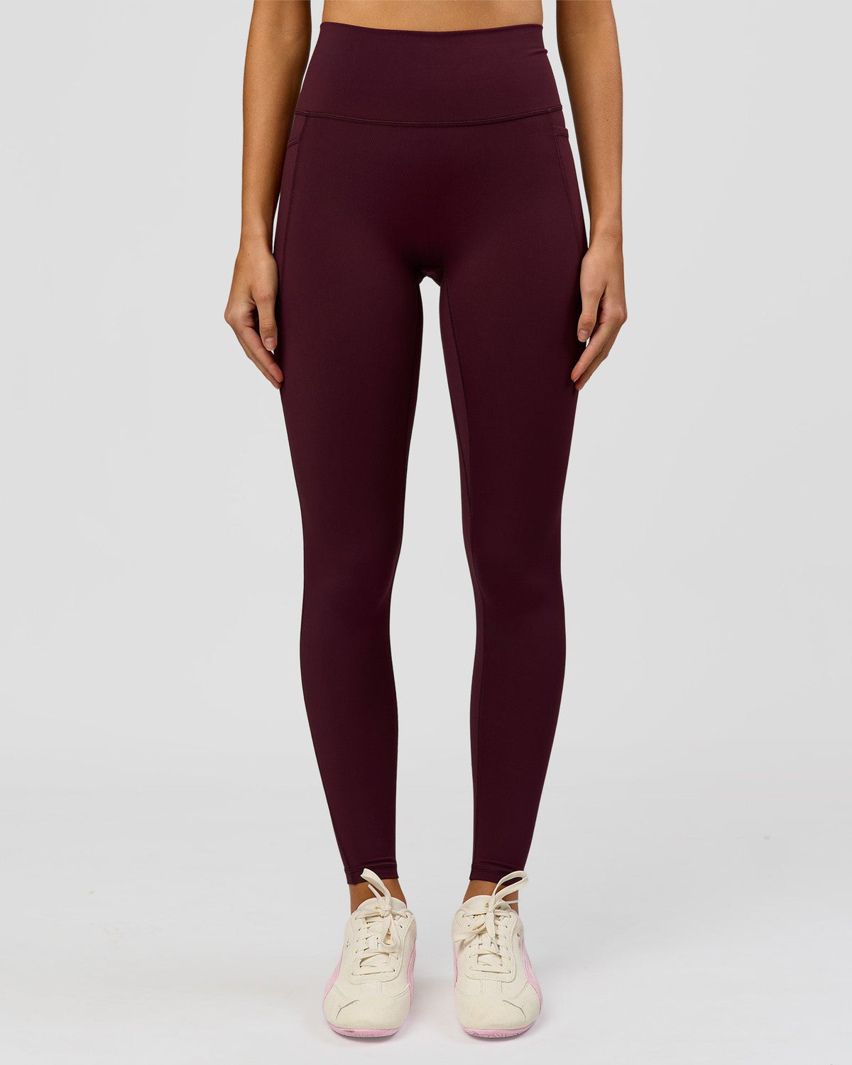 Woman wearing Fusion V-Contour Ultra High-Rise Full Length Legging Pockets - Cherry Lacquer | Model:Taneisha | Size:XS