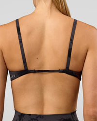 Woman wearing Minimal Sports Bra - Black Tie Dye | Model:Taneisha | Size:XS | Thumbnail Index: 2