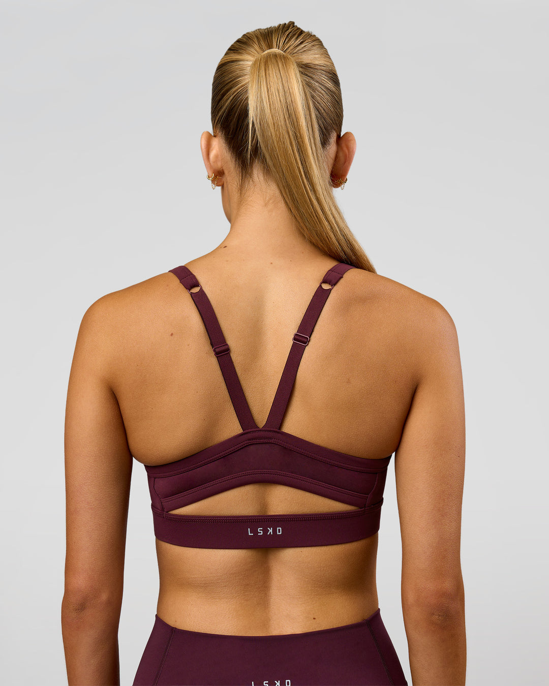 Woman wearing Momentum Sports Bra - Cherry Lacquer | Model:Taneisha | Size:XS - view 7
