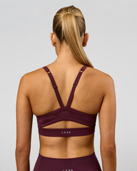 Woman wearing Momentum Sports Bra - Cherry Lacquer | Model:Taneisha | Size:XS | Thumbnail Index: 6