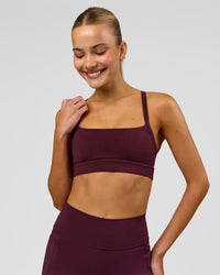 Woman wearing Momentum Sports Bra - Cherry Lacquer | Model:Taneisha | Size:XS | Thumbnail Index: 7