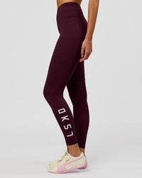 Woman wearing Rep Ultra High-Rise Full Length Legging Pockets - Cherry Lacquer-White | Model:Taneisha | Size:XS | Thumbnail Index: 0
