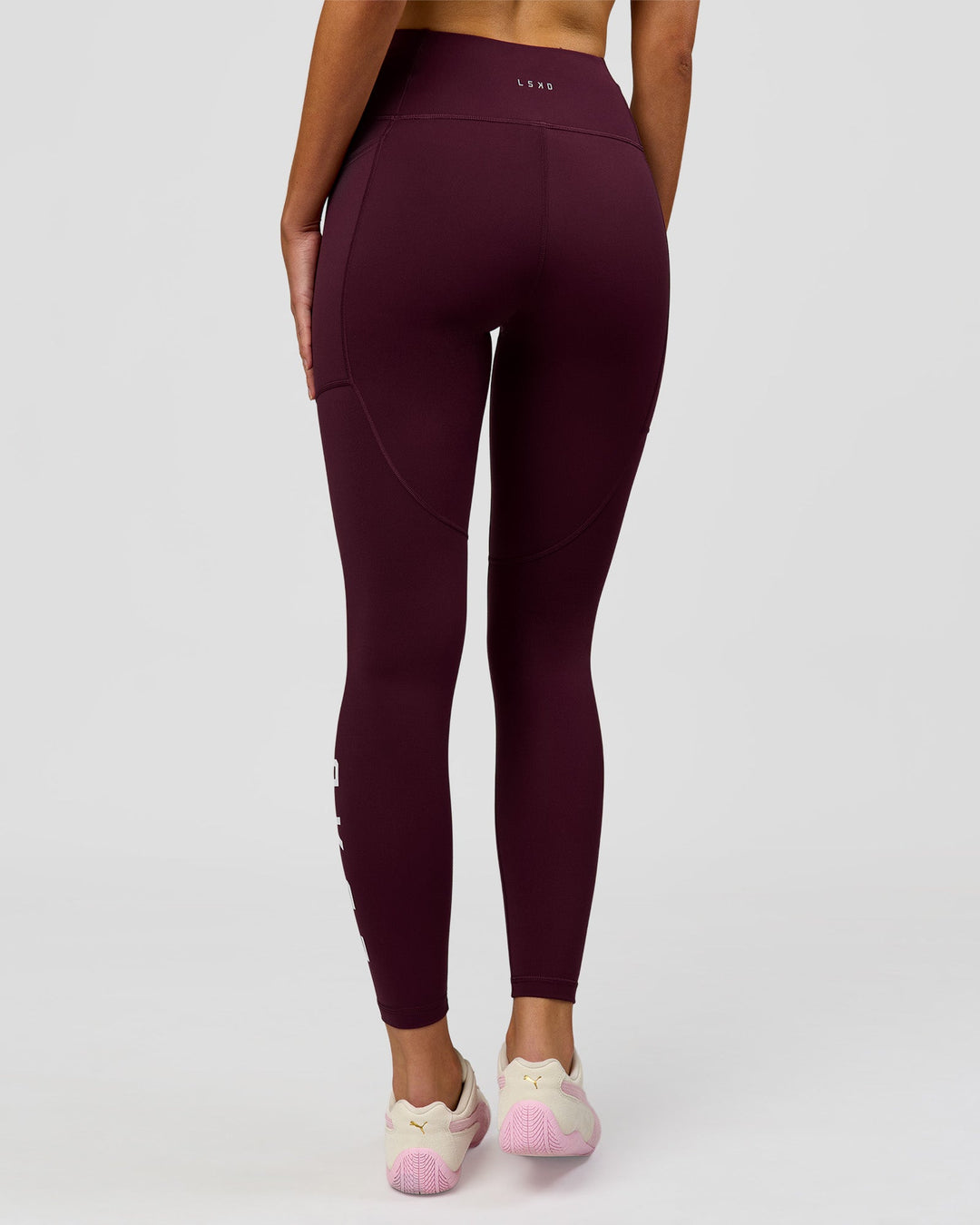 Woman wearing Rep Ultra High-Rise Full Length Legging Pockets - Cherry Lacquer-White | Model:Taneisha | Size:XS - view 2