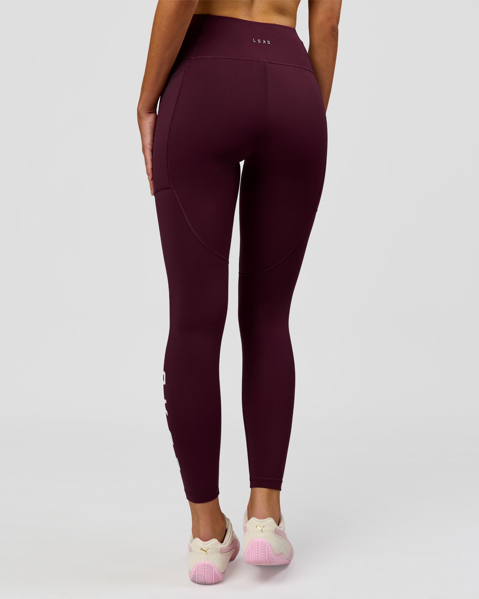 Woman wearing Rep Ultra High-Rise Full Length Legging Pockets - Cherry Lacquer-White | Model:Taneisha | Size:XS