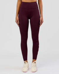 Woman wearing Rep Ultra High-Rise Full Length Legging Pockets - Cherry Lacquer-White | Model:Taneisha | Size:XS | Thumbnail Index: 2