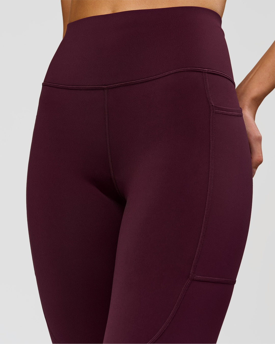 Woman wearing Rep Ultra High-Rise Full Length Legging Pockets - Cherry Lacquer-White | Model:Taneisha | Size:XS - view 5