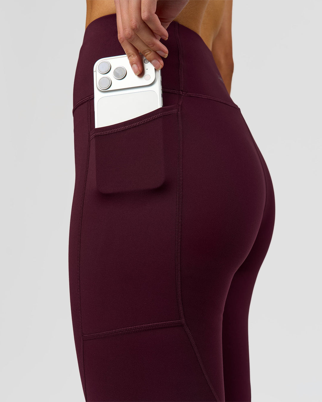 Woman wearing Rep Ultra High-Rise Full Length Legging Pockets - Cherry Lacquer-White | Model:Taneisha | Size:XS - view 6