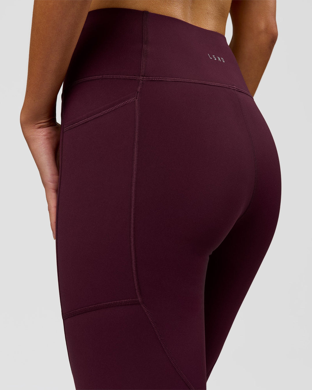 Woman wearing Rep Ultra High-Rise Full Length Legging Pockets - Cherry Lacquer-White | Model:Taneisha | Size:XS - view 7