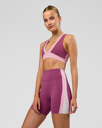 Woman wearing Revitalise Ultra High-Rise 6" Short - Boysenberry-Pink Rose | Model:Taneisha | Size:XS | Thumbnail Index: 1