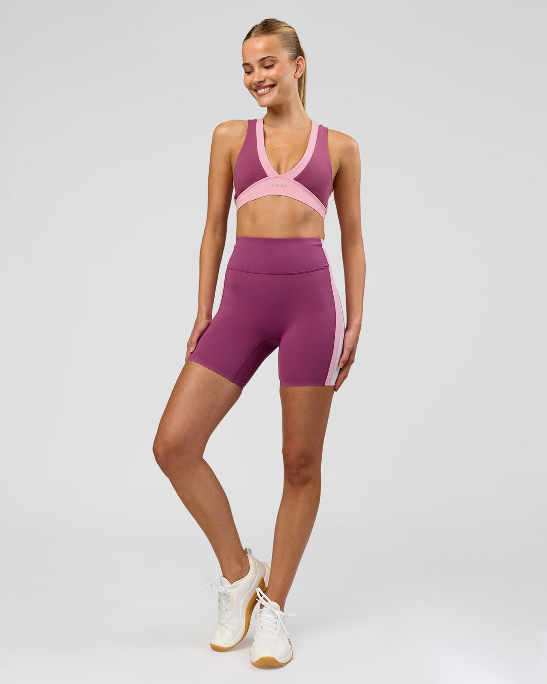 Woman wearing Revitalise Ultra High-Rise 6" Short - Boysenberry-Pink Rose | Model:Taneisha | Size:XS - view 4