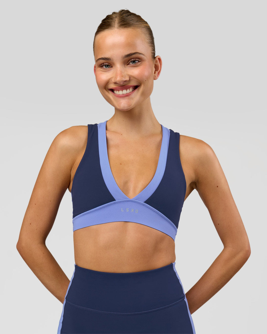 Woman wearing Stamina Layered Sports Bra - Future Navy-Bluebell | Model:Taneisha | Size:XS - view 4