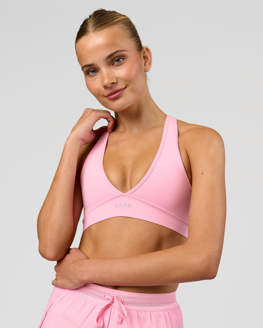 Woman wearing Stamina Sports Bra - Pink Rose | Model:Taneisha | Size:XS