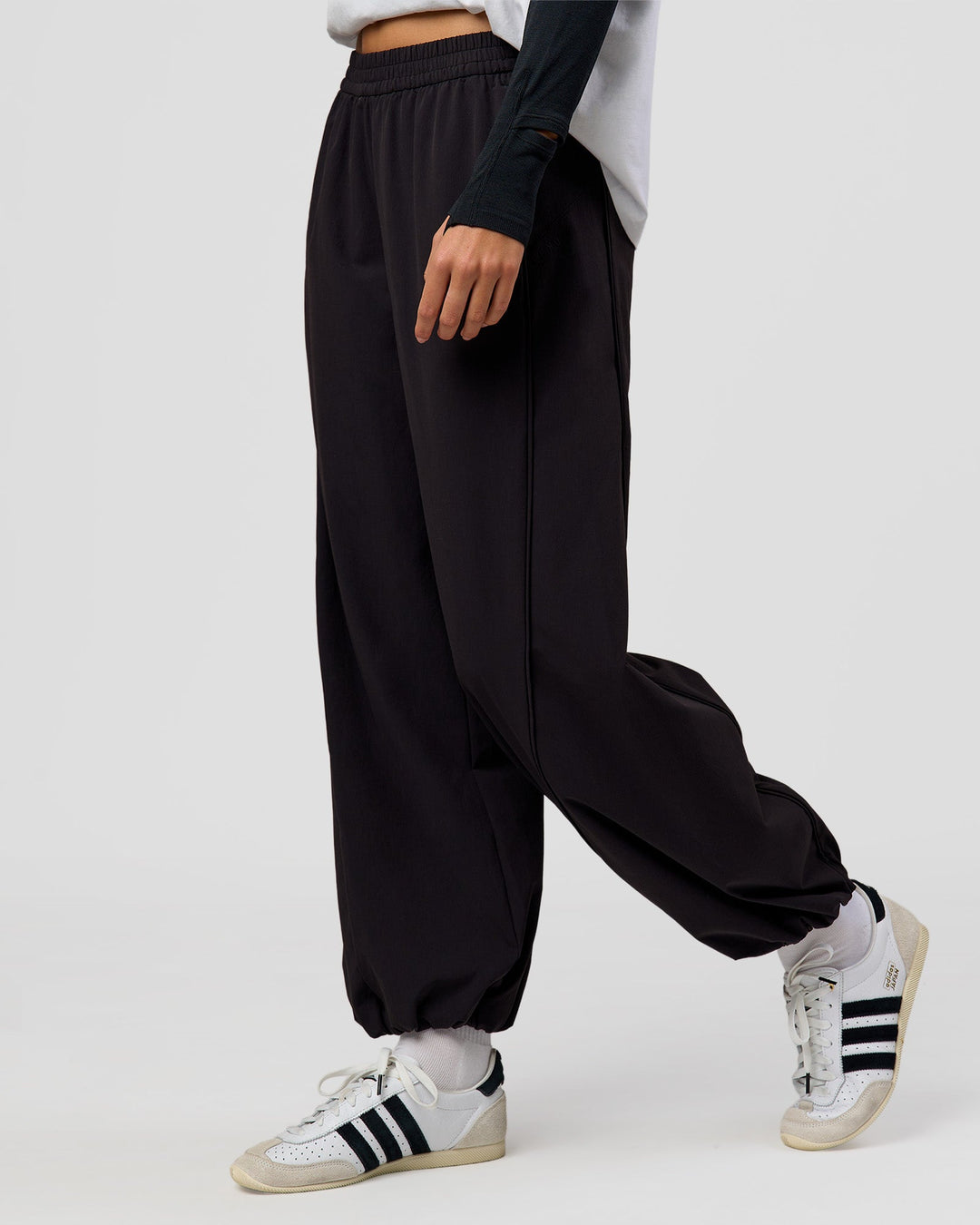 Woman wearing Stitch Up Track Pant - Black | Model:Taneisha | Size:XS - view 1