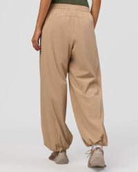 Woman wearing Stitch Up Track Pant - Warm Smoke | Model:Taneisha | Size:XS | Thumbnail Index: 4