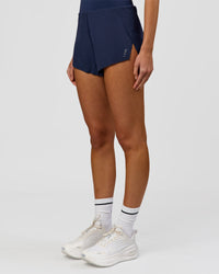 Woman wearing Tia-Clair Toomey-Orr Legacy 3" Run One-Piece - Future Navy | Model:Taneisha | Size:XS | Thumbnail Index: 11