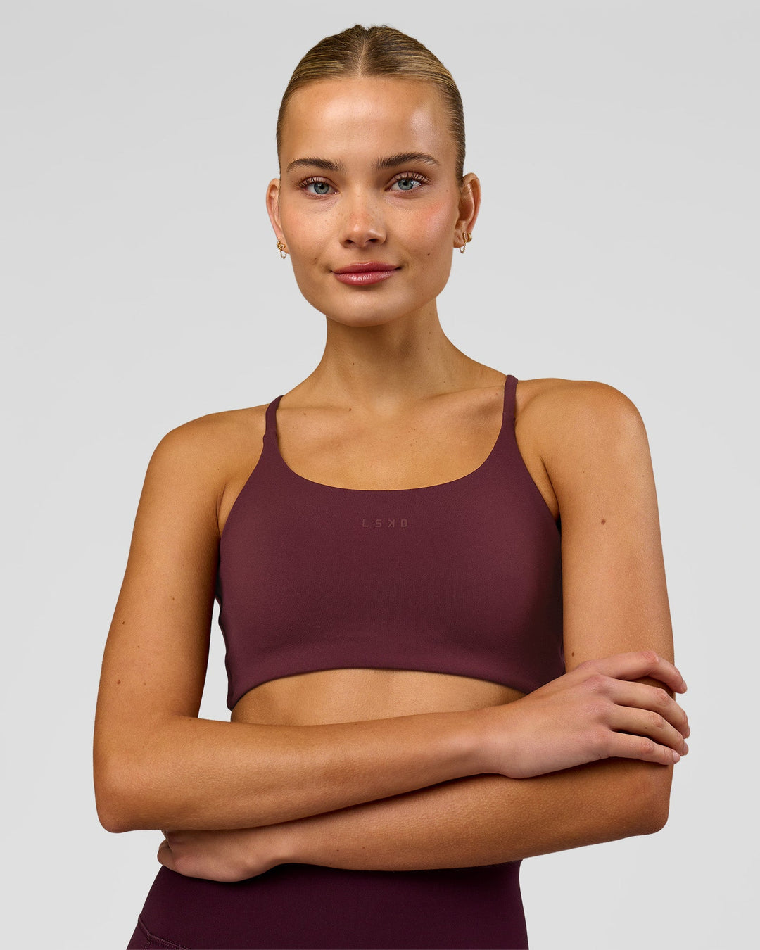 Woman wearing Twist Sports Bra - Cherry Lacquer | Model:Taneisha | Size:XS - view 4