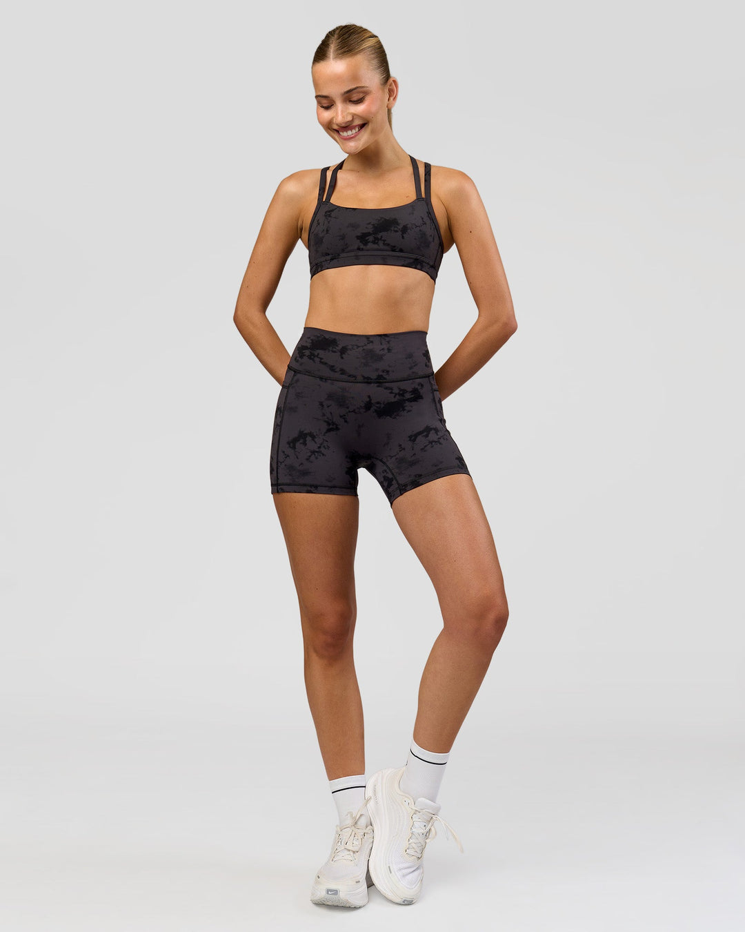 Woman wearing Velocity Sports Bra - Black Tie Dye | Model:Taneisha | Size:XS - view 3